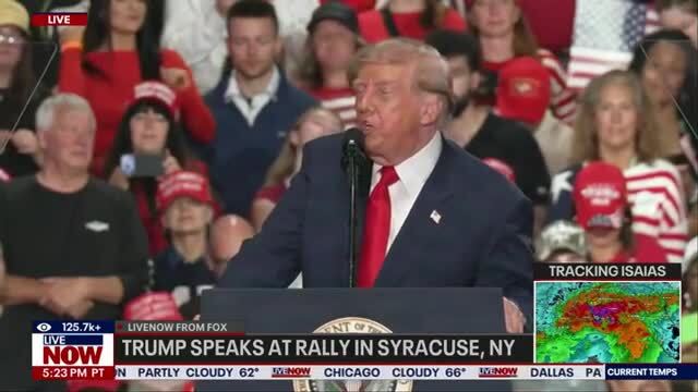 Woman Escorted From Trump Rally Gives President Double Middle Finger on Way Out